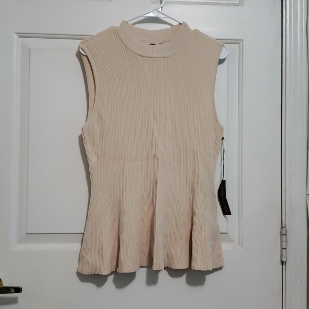 Eva Mendes beige peplum top